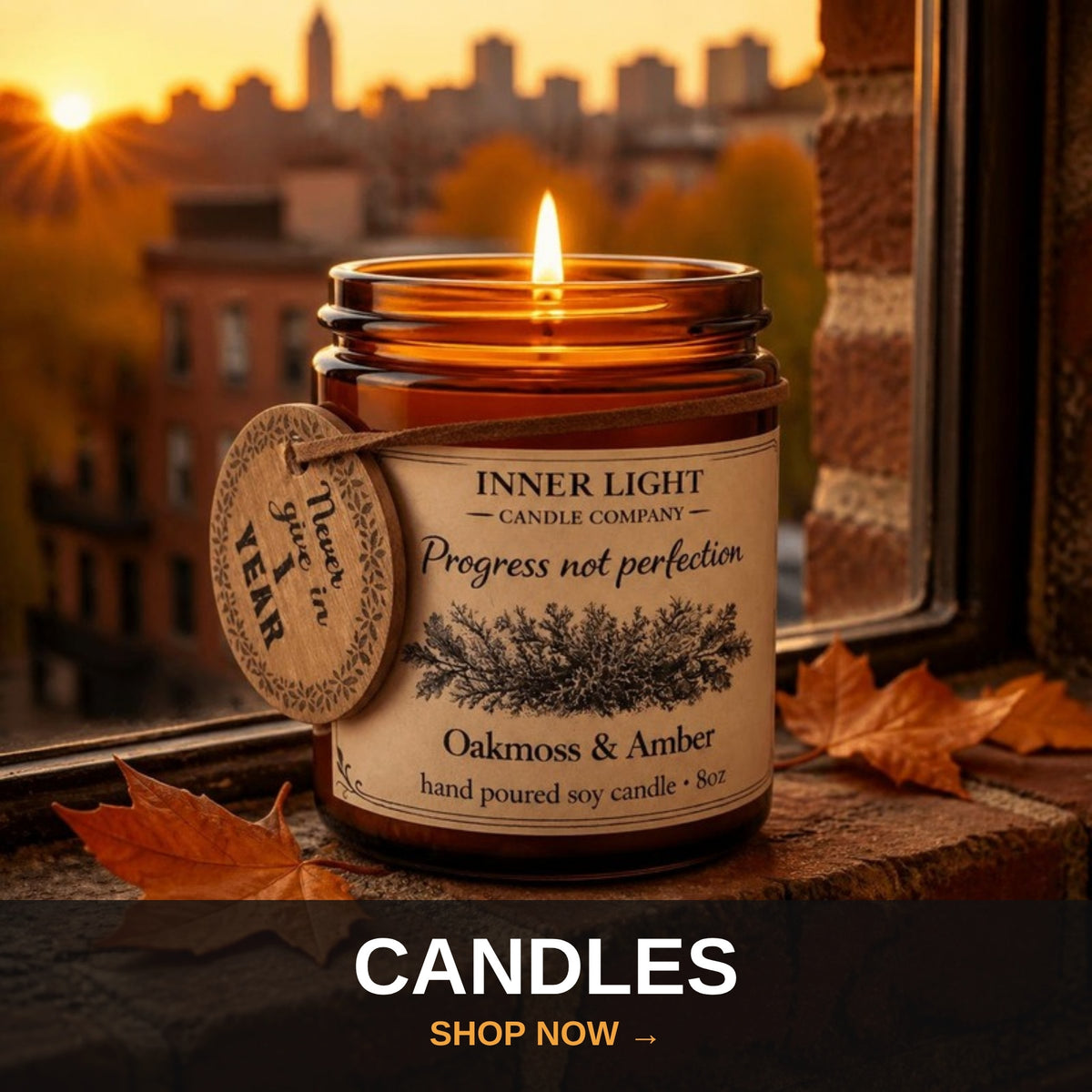 Recovery candles - Progress Not Perfection candle on a city windowsill at fall sunset